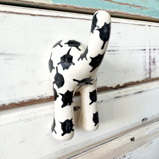 Black and white ceramic dog tail hook