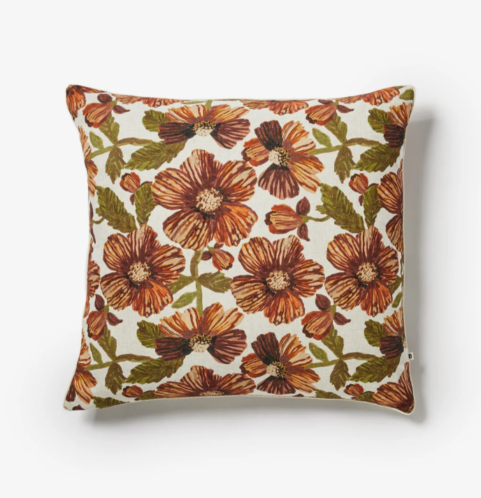 Bonnie & Neil - Woodland Hazelnut 60cm Cushion. Floral printed linen cushion with brown and green flowers on a cream background with thin cream piping
