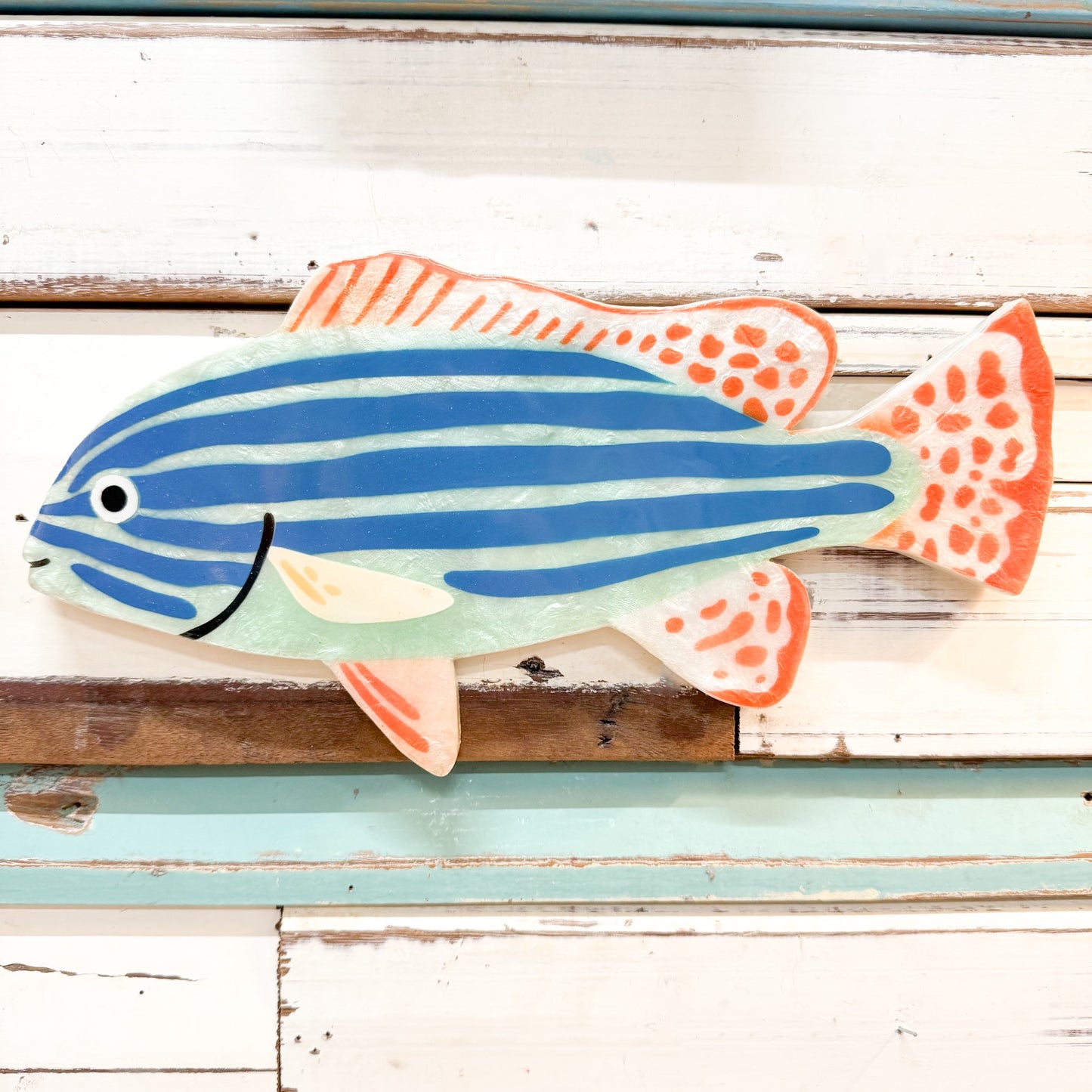Colorful fish-shaped capiz shell art