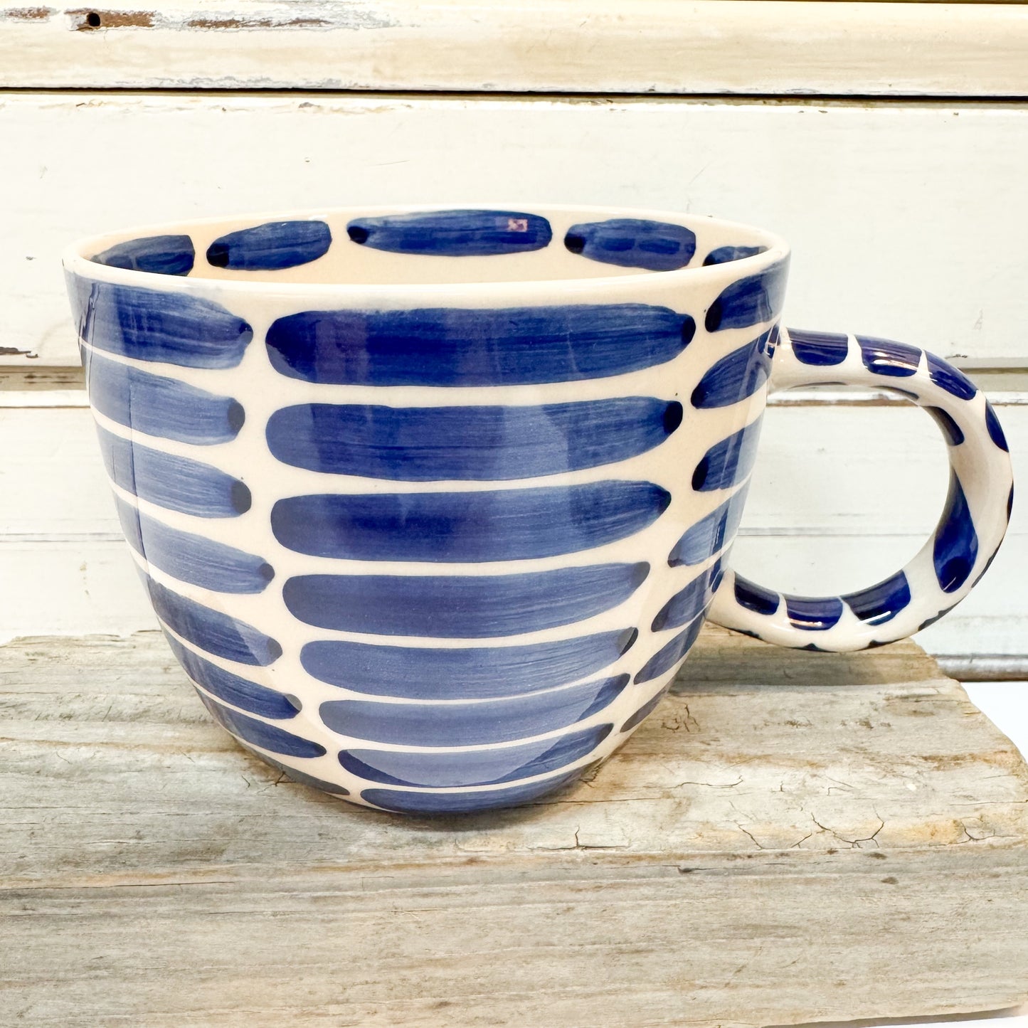 Blue and white ceramic mug with a paint brush stroke stripe. Jones & Co - Boss Chino Mug - Blue Stripe