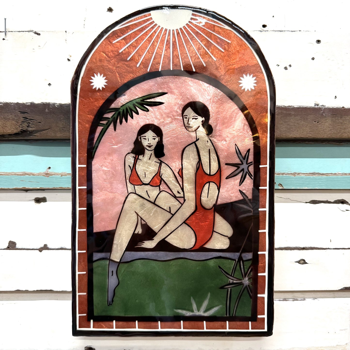 Jones & Co - Resort Toe Dip Green Tile- Stained glass style capiz shell panel of two women in swimsuits with a beach scene.