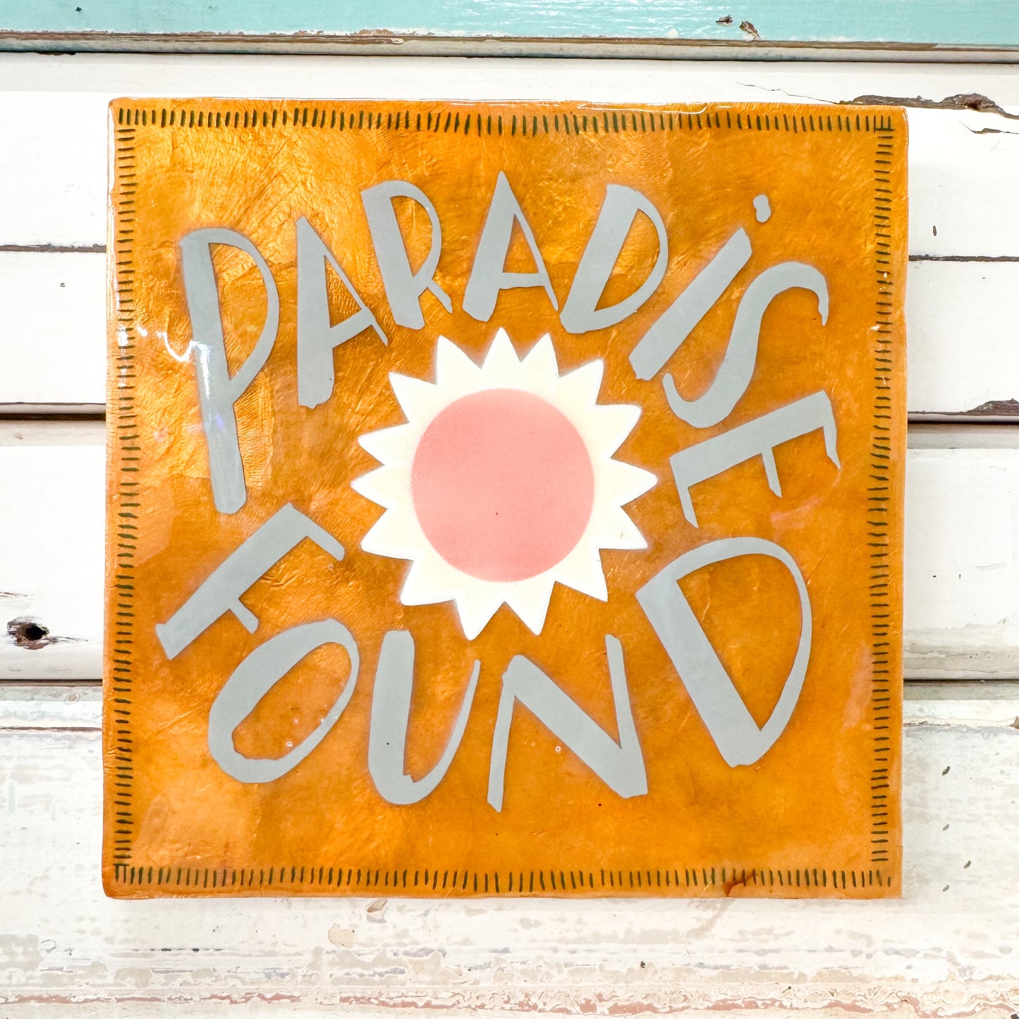 Decorative sign with 'Paradise Found' text and sun graphic - Jones & Co - Superette Paradise Gold Tile