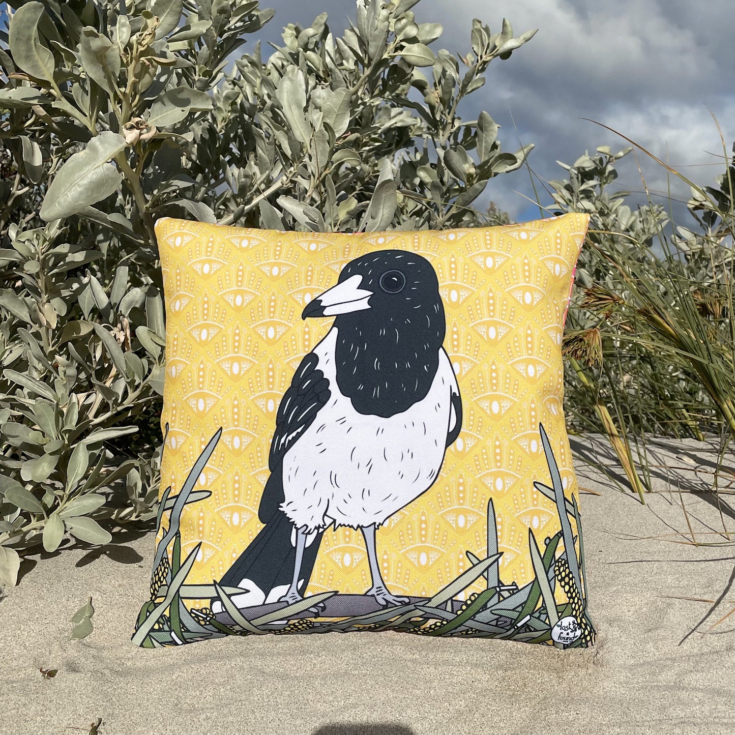 LOST AND FOUND ART CO Butcher Bird 40cm Cushion. Yellow pillow with a central magpie design.
