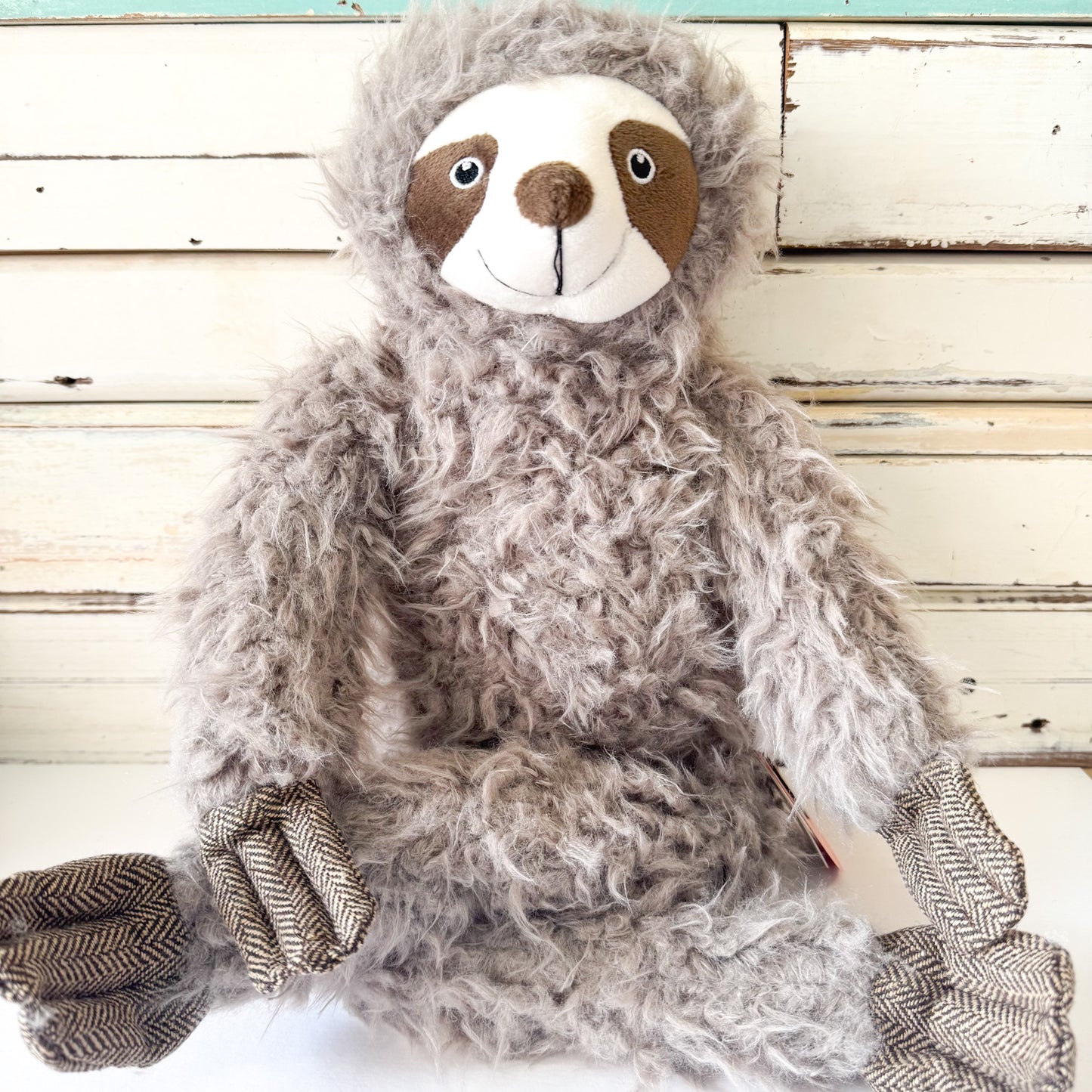 Lily & George - Sofia The Sloth. Plush sloth toy with a smiley face and long arms and legs.