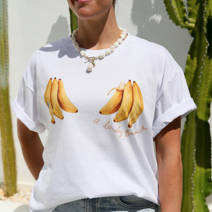 WHITE TEE SHIRT WITH BANANAS AND READS "A LOVELY BUNCH"