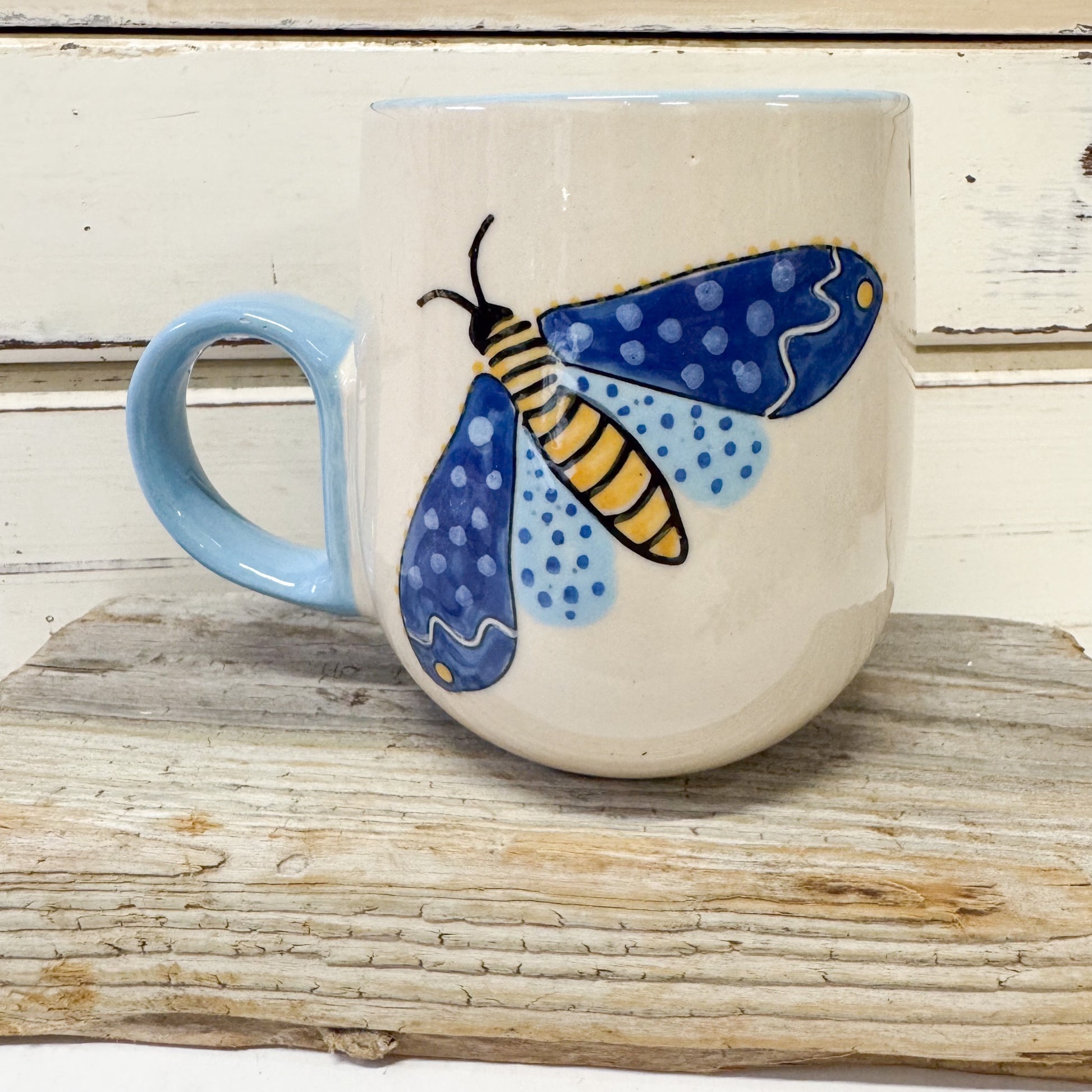 Jones and Co ceramic mug with handpainted blue moth