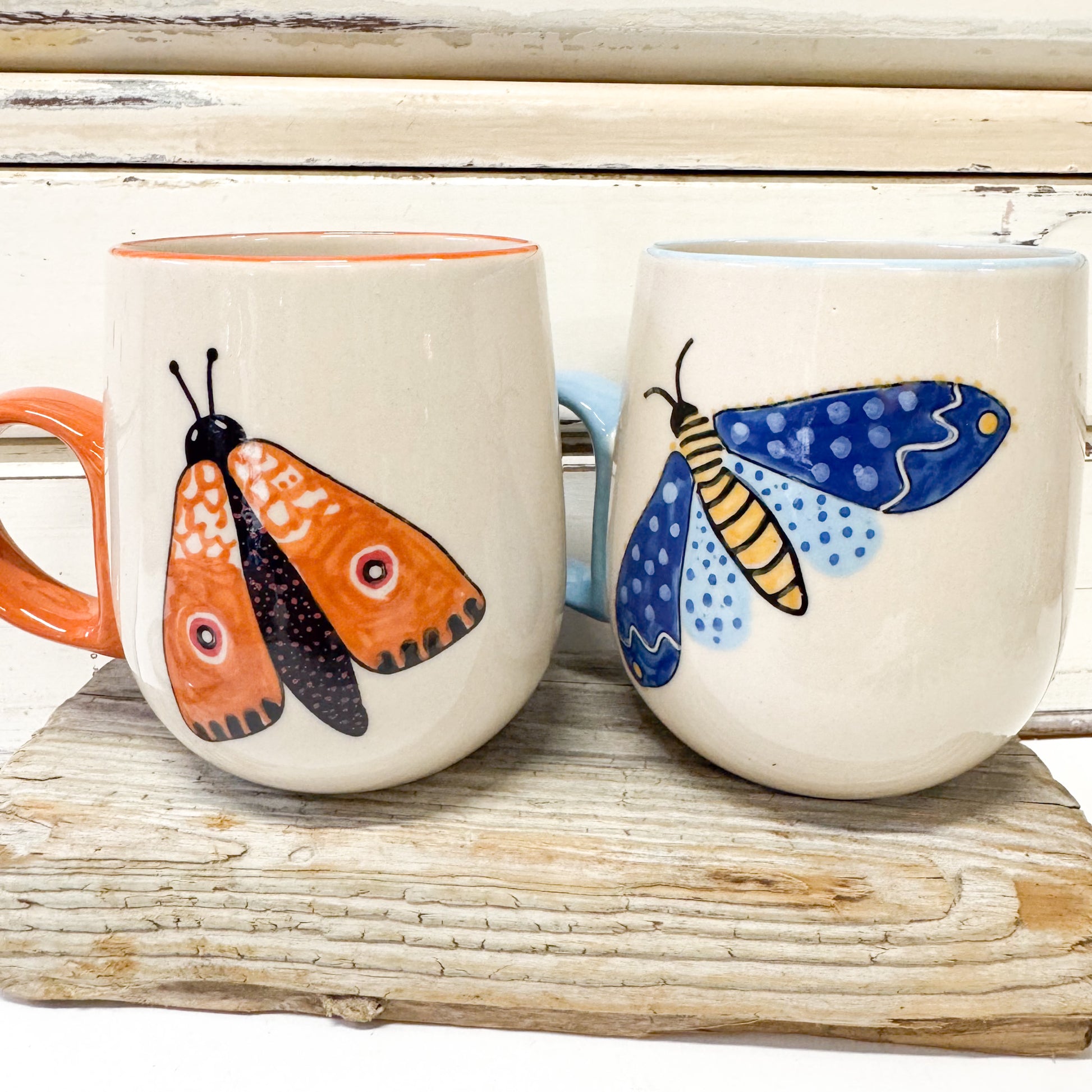 two Ceramic mugs with painted moths