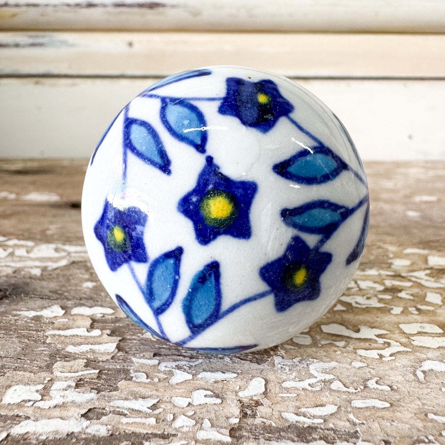 Ceramic knob with blue floral pattern