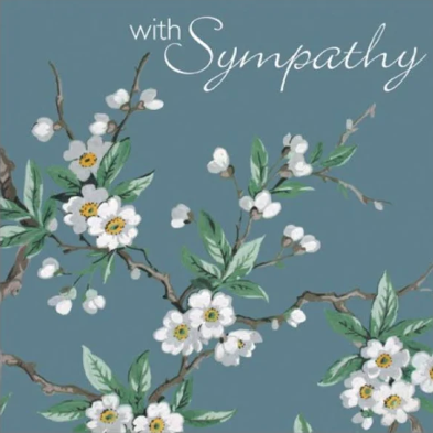 A sympathy card with a floral pattern and the text 'with Sympathy' printed on it.