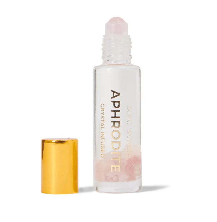 A crystal infused essential oil blend to cultivate love & abundance in your life. A light natural perfume alternative. Available at The Brightside Store.
