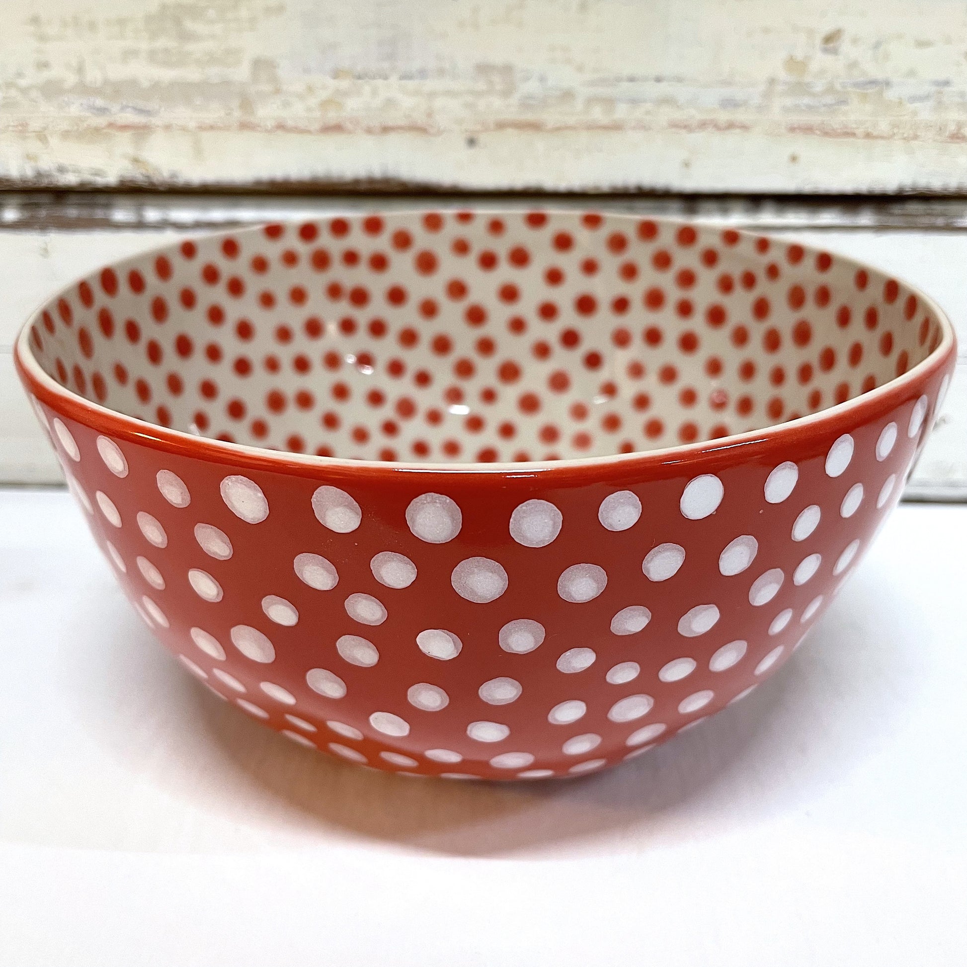 JONES AND CO CERAMIC RED BOWL WITH SPOTS