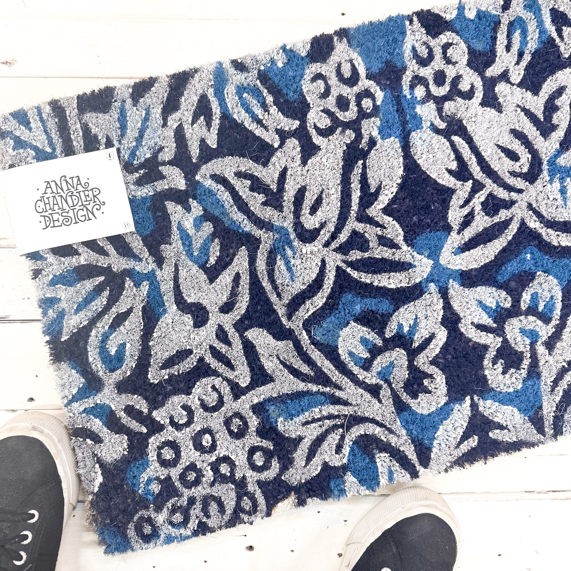 Blue and silver patterned rug with 'Anna Chandler Design' tag 
Anna Chandler - Long Doormat - Indigo