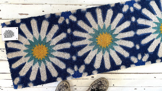 Coir doormat with daisy pattern on blue by  Anna Chandler Design - Casablanca Long Doormat 