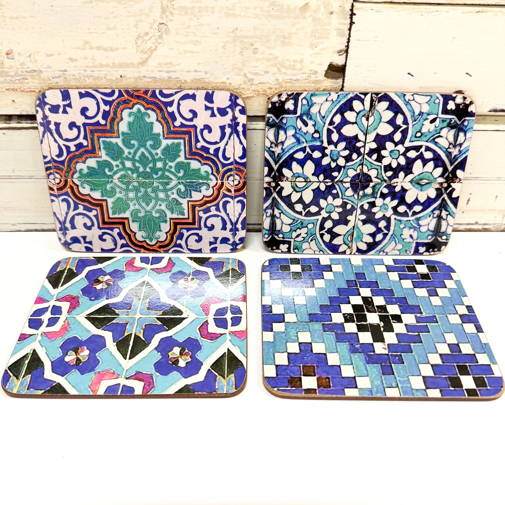 Four colorful ceramic coasters with intricate patterns
Anna Chandler Design - Coaster Set 4 - Vases on Turquoise