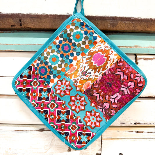 Colorful patterned pot holder with turquoise border  
Anna Chandler Design - Pot Holder - Wildflower Tile