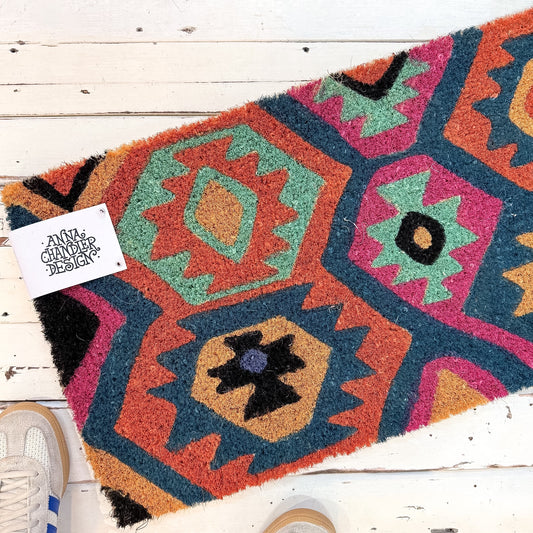 Colorful geometric-patterned rug. Anna Chandler Doormat - Kelim Long