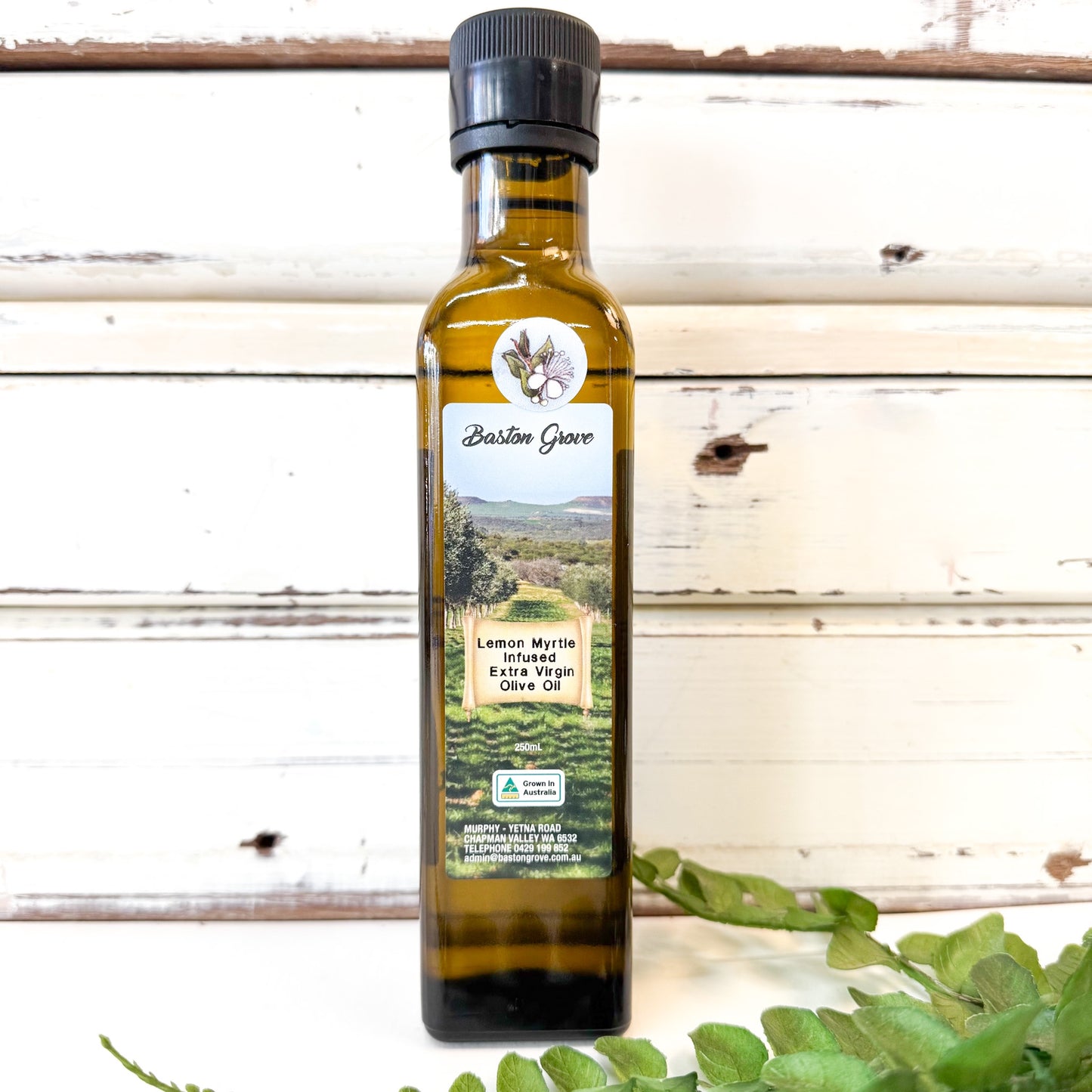 Bottle of BASTON GROVE Lemon Myrtle Infused Olive Oil with a label 