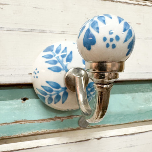 Decorative wall hook with blue floral design 