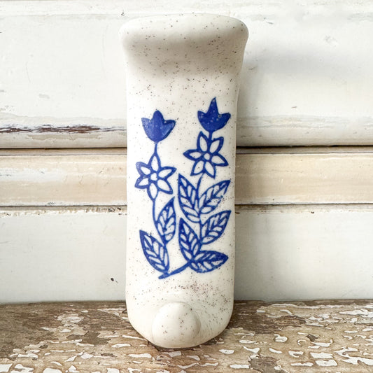 White ceramic hook with blue floral design 