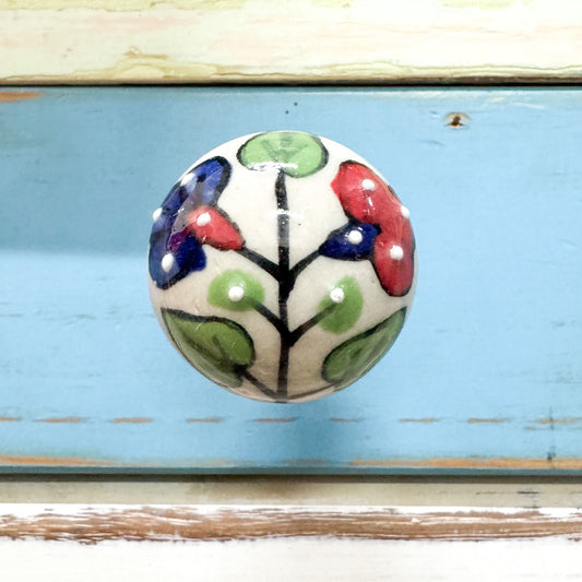 Decorative ceramic knob hook with floral design that screws straight into the wall