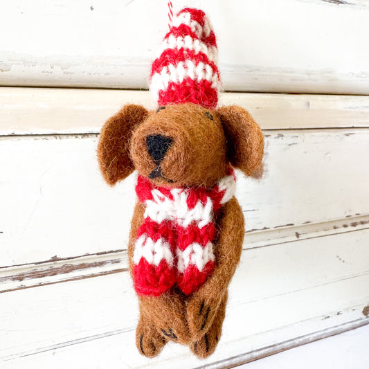 Felted dog  decoration wearing a red and white striped hat and scarf. Christmas Decorations - Dog Daniel