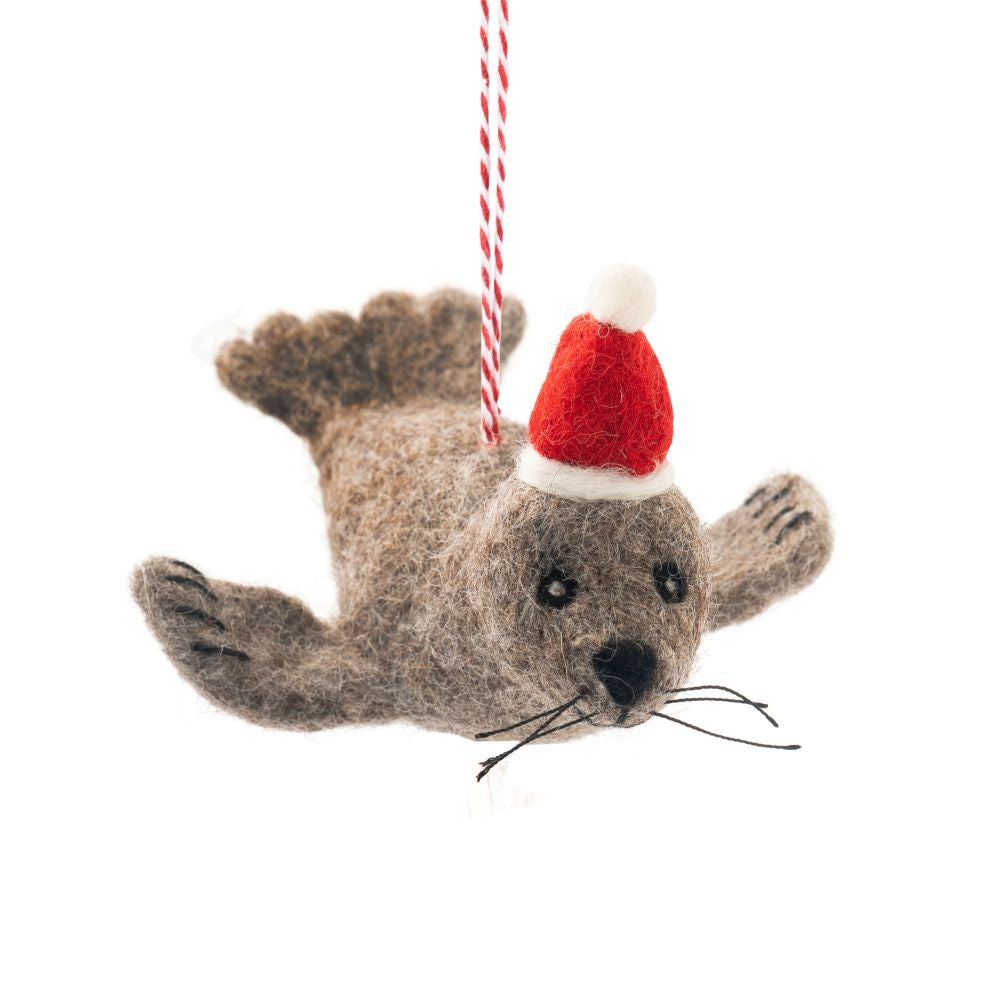 Felted seal ornament wearing a Santa hat on a white background - Christmas Decorations - Fur Seal Seth