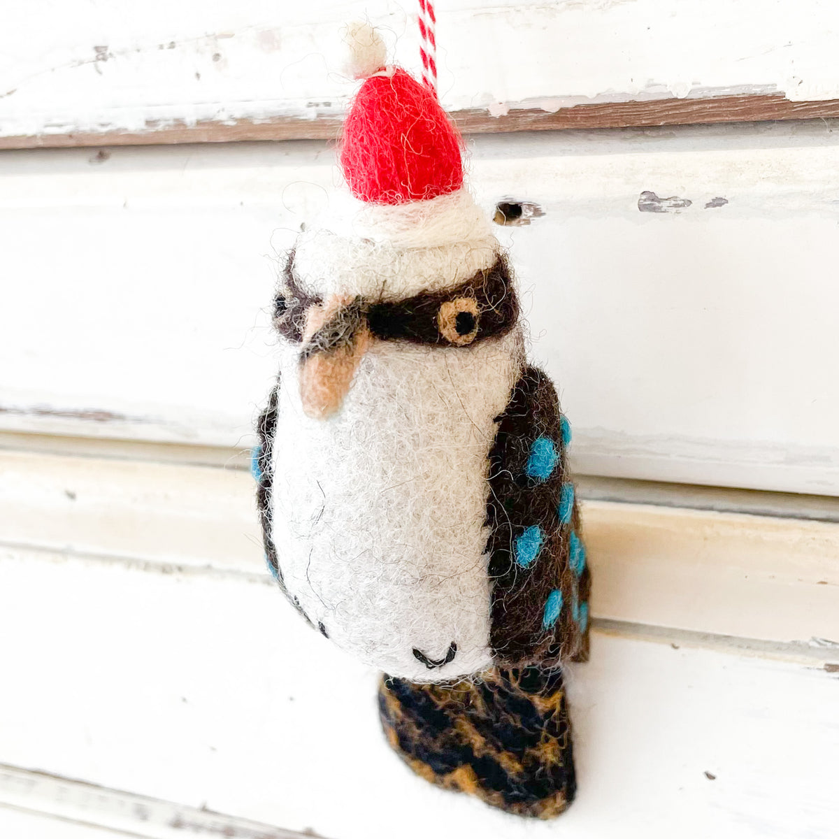 Felted owl ornament with a red hat on a wooden background - Christmas Decorations - Kookaburra Kate