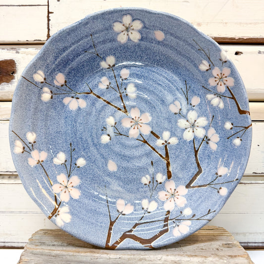 Concept Japan - Fujizakura Blossom Deep Plate. Ceramic plate with cherry blossom design on blue.