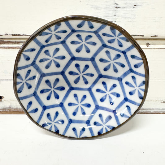 Concept Japan - Hanakikkou Dish. Ceramic plate with blue geometric pattern on a white background
