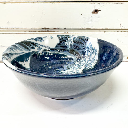 Concept Japan - Namiura Bowl. Ceramic bowl with blue and white wave design.