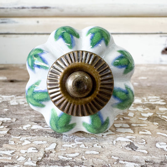 Decorative ceramic knob with green leaf pattern 