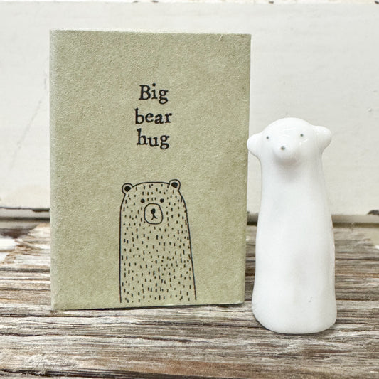 white ceramic bear figurine with matchbox that reads 'Big bear hug' 