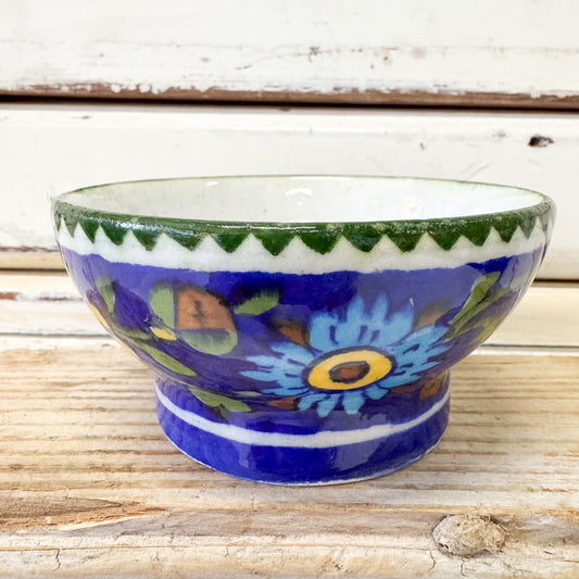 Indian Ceramics - Jaipur Green Tapas Bowl. Ceramic bowl with floral design on a wooden surface