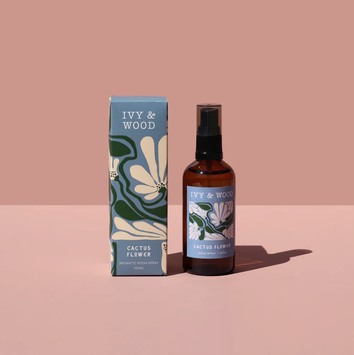 Ivy & Wood Cactus Flower room spray bottle and packaging on a pink background