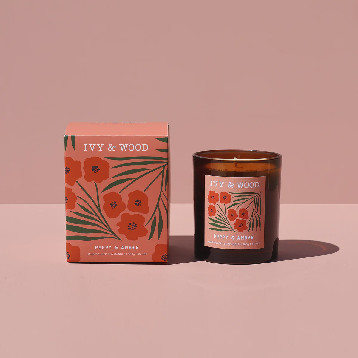 IVY & WOOD candle and packaging on a pink background - Ivy & Wood - Poppy & Amber Scented Candle