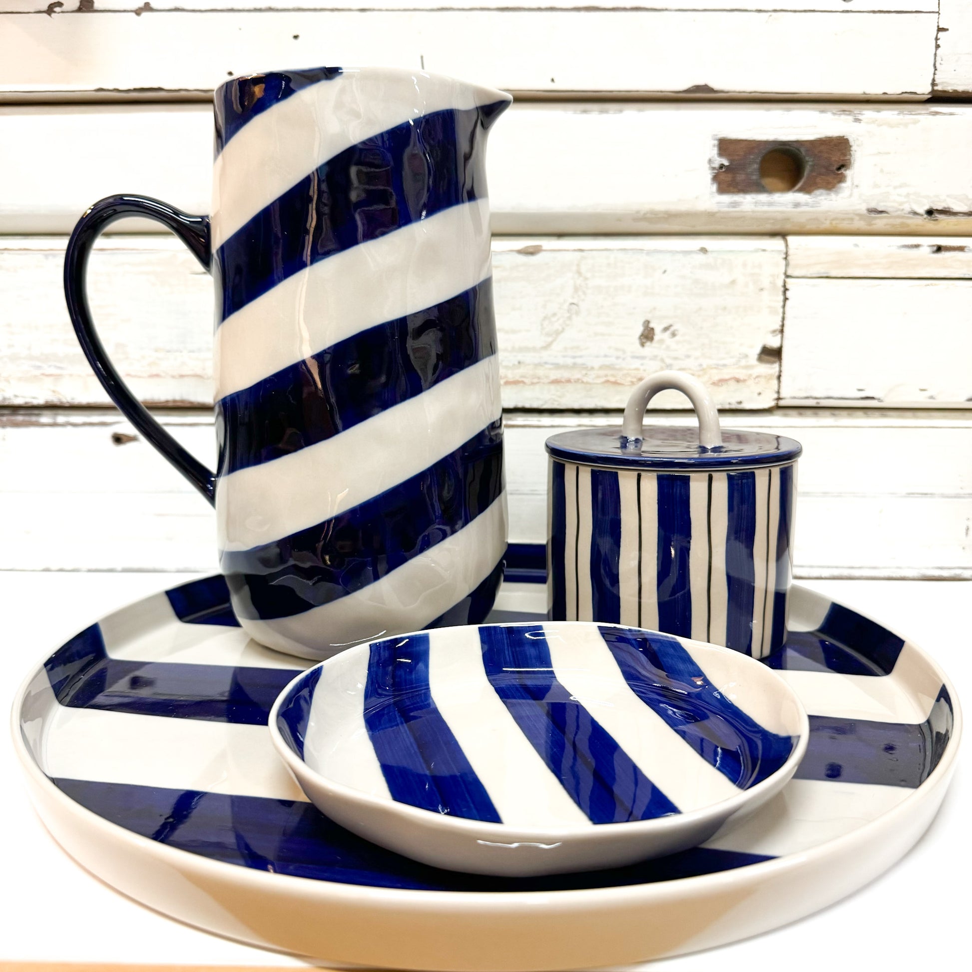 JONES AND CO CERAMIC JUG WITH DIAGONAL BLUE STRIPES