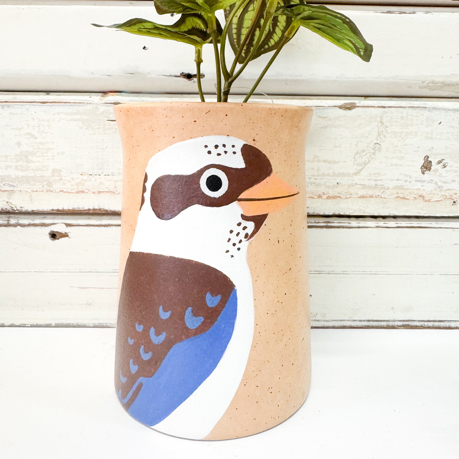Cylindrical vase with a bird design. Jones & Co - Aerial Kookaburra Vase