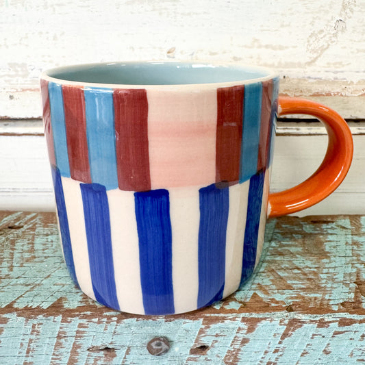 Colorful striped mug with an orange handle. Jones & Co - Bloomie Blue Stripe Mug