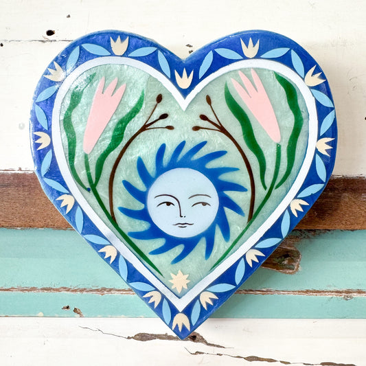 Jones & Co - Fable Sun Blue Heart. Decorative heart-shaped tile with a sun and floral design 