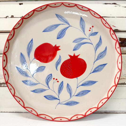 Ceramic plate with red pomegranate design on a white background - Jones & Co - Granada Platter