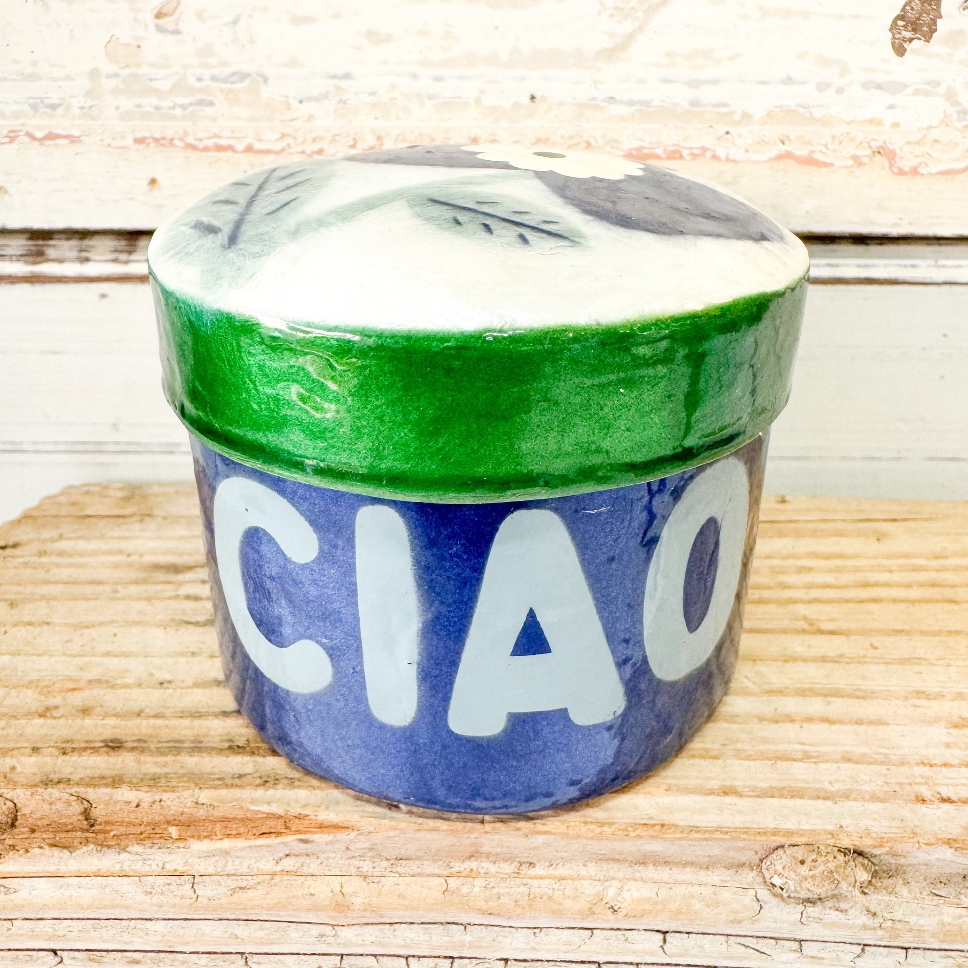 Capiz shell container with green rim and 'CIAO' text 