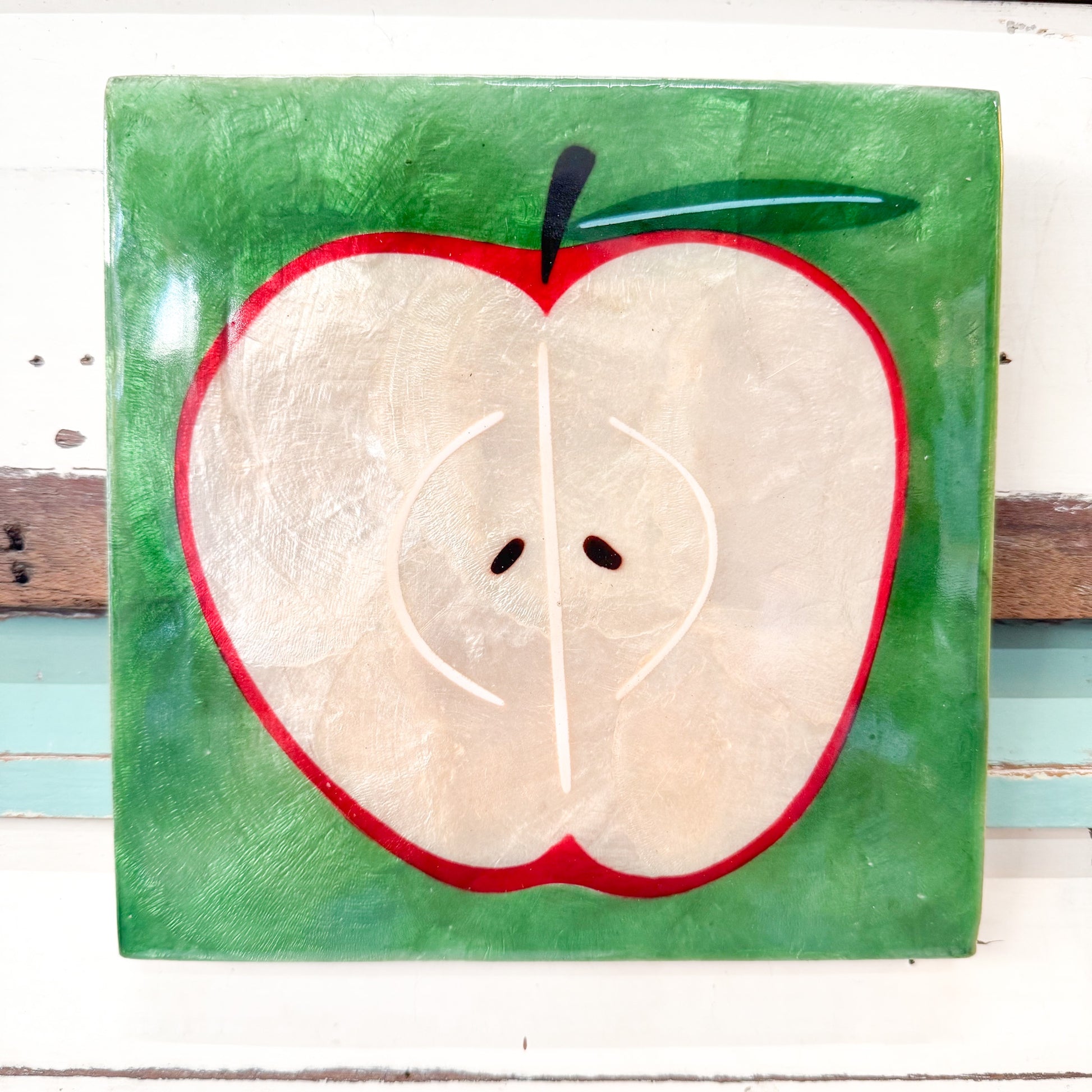 Painting of a sliced apple on a green background Jones & Co - Superette Apple Tile