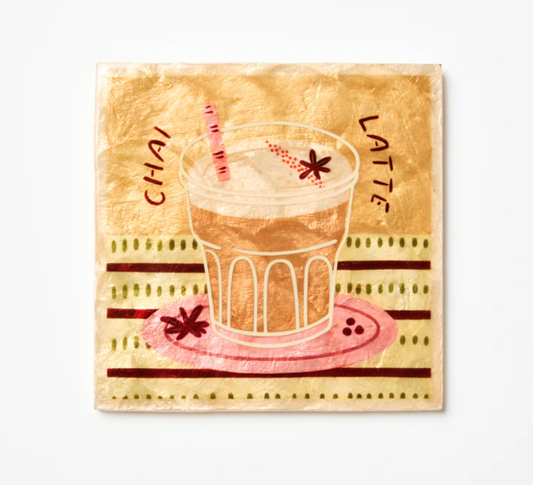 Shiny Capiz shell tile with a design of a chai latte and text on a beige background
