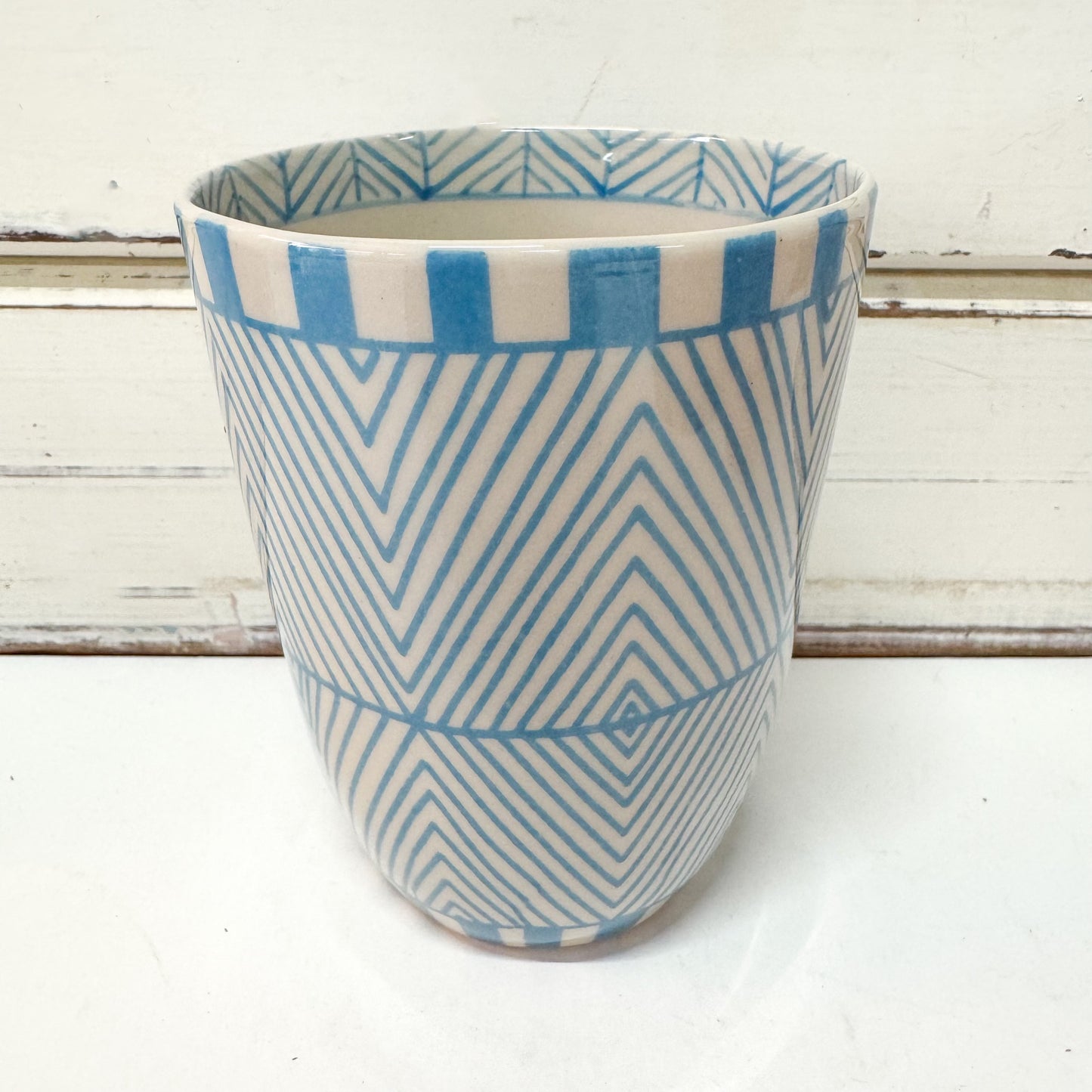 Jones & Co Caravan Cup - Sky tumbler style ceramic cup with hand painted light blue geometric pattern