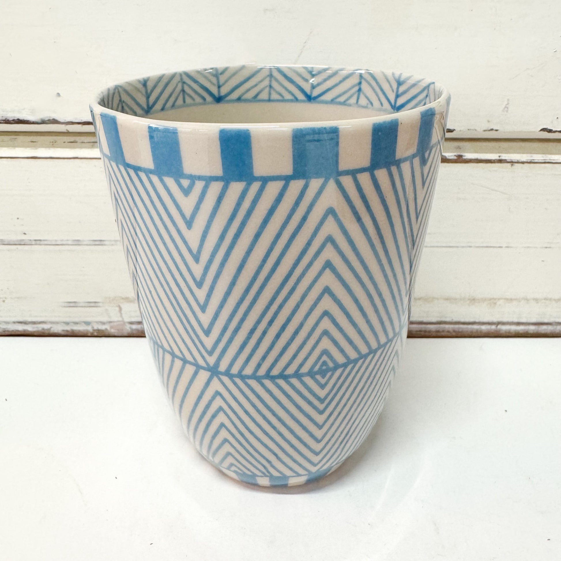 Jones & Co Caravan Cup - Sky tumbler style ceramic cup with hand painted light blue geometric pattern