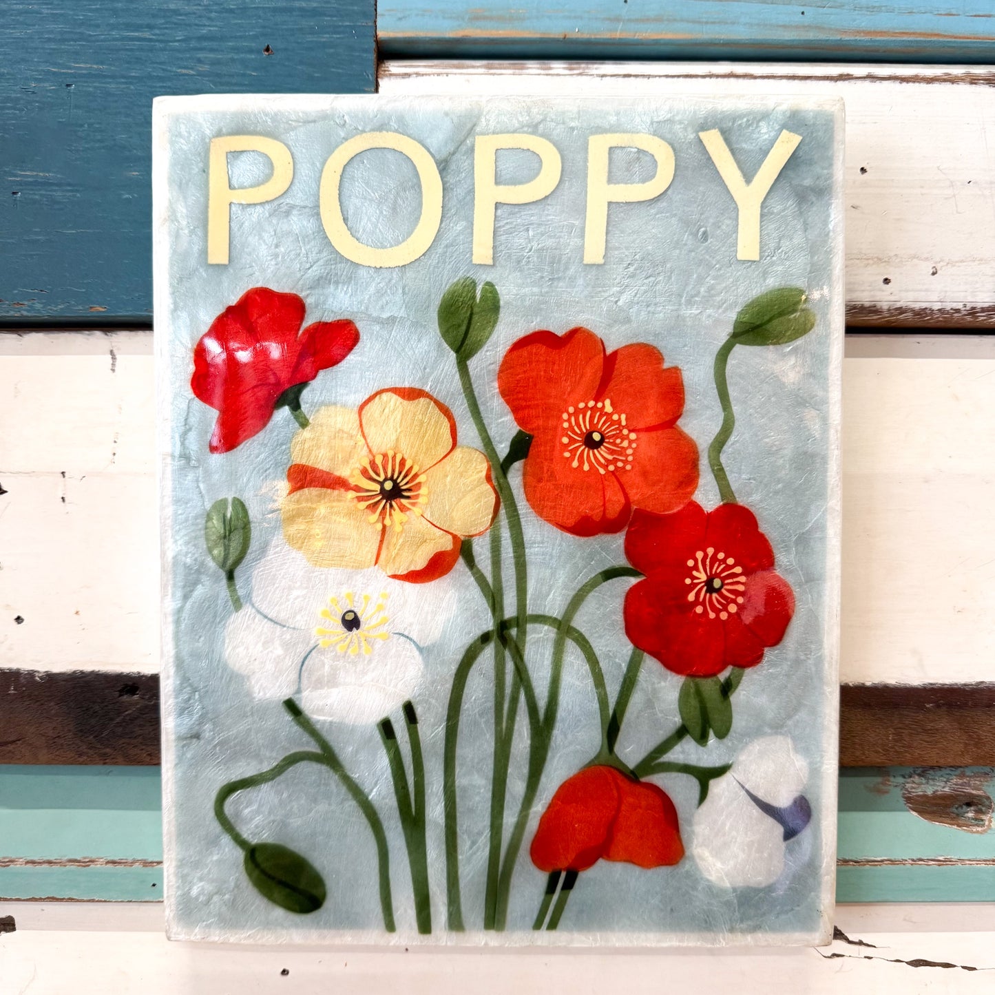 Decorative cAPIZ SHELL TILE with a floral poppy  design on a white background Jones & Co | Market Wall Art Poppy