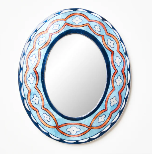 Decorative mirror with a blue and orange floral frame on a white background