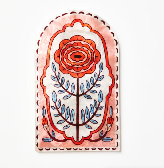Decorative cAPIZ SHELL TILE with a floral design on a white background
