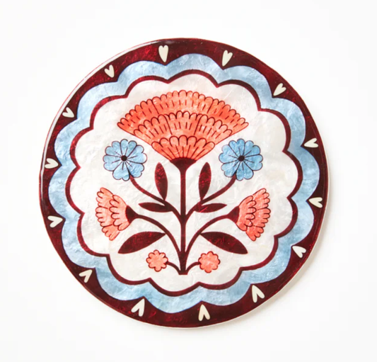 Decorative plate with floral design on a white background