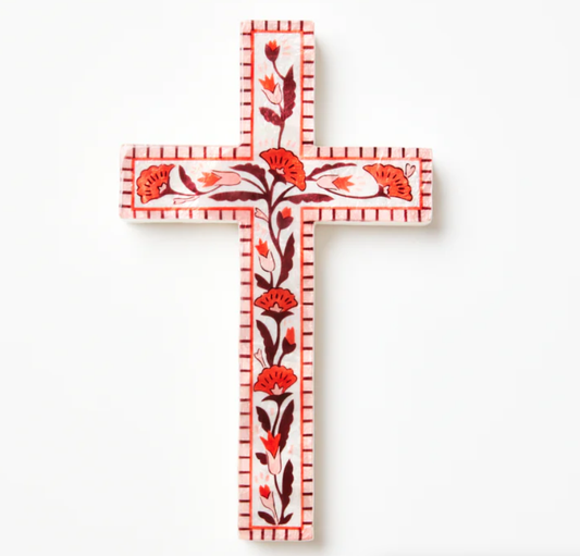 Decorative cross with floral patterns on a white background
